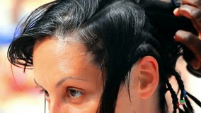 Traditional African hairstyles on white women, Black woman weaves traditional Afro hairstyle on white women, Video clip