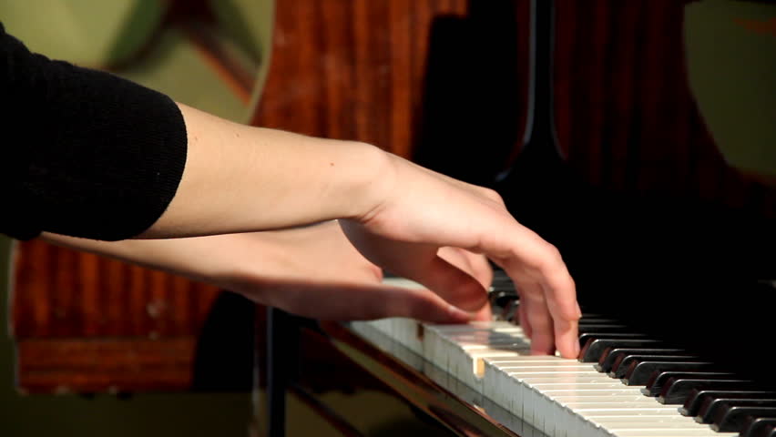 She play piano well. Piano hand stock.