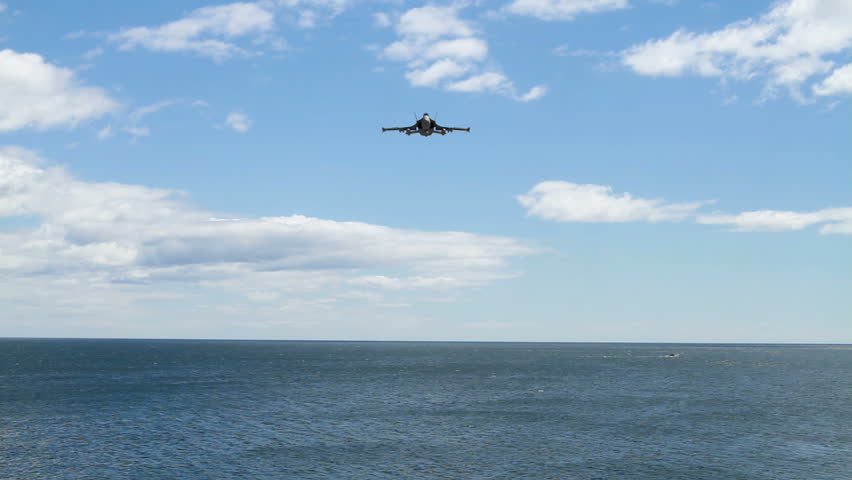 A F18 Hornet flying over the ocean at low altitude. (3D Animation)