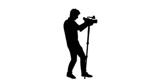 Cameraman monopod silhouette shooting - 1080p
Silhouette of a cameraman with a monopod shooting video - Full HD