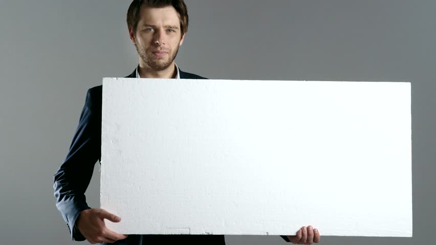 Businessman holding blank paper with copy space for business message.