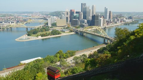 The Duquesne Incline ascends Mt. Washington with a view of downtown Pittsburgh, Pennsylvania, at the confluence of the Allegheny and Monongahela Rivers, in the background