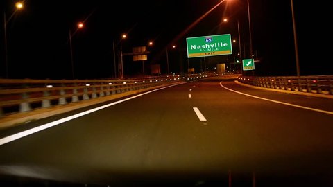 Driving on Highway/interstate at night, Exit sign of the City Of Nashville, Tennessee