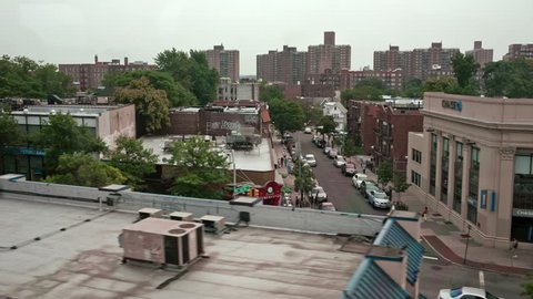 NEW YORK - JULY 14, 2014: Queens viewed from moving MTA subway in New York. Queens is the easternmost and largest of the five New York City boroughs, adjacent to the borough of Brooklyn.