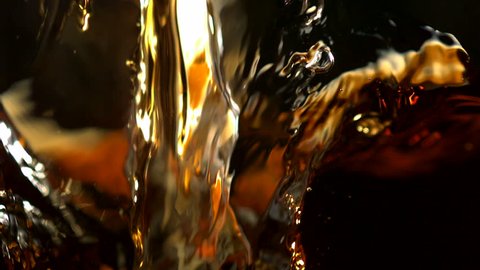 Pouring brown color liquid shooting with high speed camera, phantom flex.