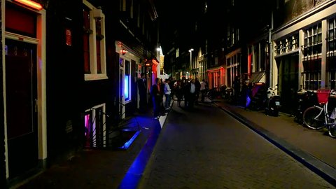 AMSTERDAM - SEP 13: Red Light District on September 13, 2014 in Amsterdam, Netherlands. There are near 500 red windows in the city rented by prostitutes and about 1000 working girls.