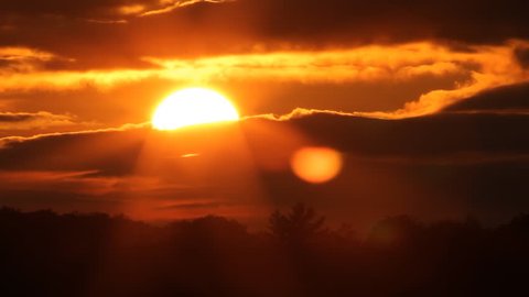 Fiery sunset with sun into clouds. Timelapse.
Sunset in Muskoka, Ontario, Canada. Timelapse.
