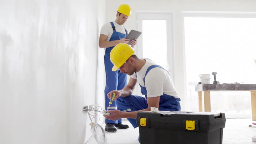 Building, renovation, technology, electricity and people concept - two builders with tablet pc computer and equipment indoors | Shutterstock HD Video #7522753