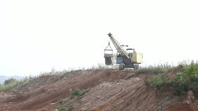 excavator digging a pit in the ground