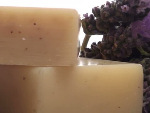 Herbal soap and fresh lavender on wooden tray zoom V2 - NTSC
