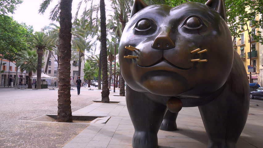 A large sculpture of a cat sits along a street in Barcelona, Spain.