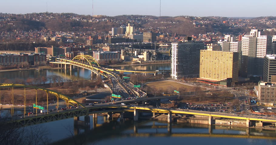 Freeways cross downtown Pittsburgh, Pennsylvania at dusk.