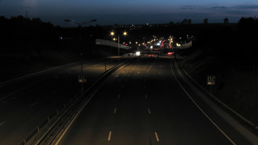 Night timelapse scene of car traffic and lights