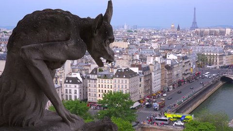 Classic shot of gargoyles watch over Paris, France from Notre Dame cathedral.