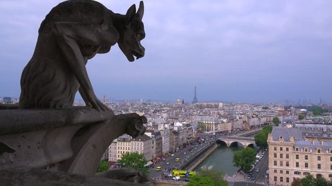 Classic shot of gargoyles watch over Paris, France from Notre Dame cathedral.