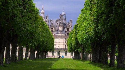View between hedgerows to the beautiful chateau of Chambord in the Loire Valley in France.