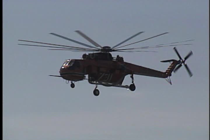 A fire helicopter demonstrating its abilities.