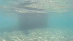 Young man diving in beautiful blue sea, Diving in the exotic seas, Video clip