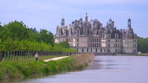CHAMBORD, FRANCE - CIRCA 2014 - Long view down a canal to the beautiful chateau of Chambord in the Loire Valley in France.