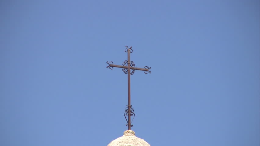 Video of Mission San Jose in San Antonio Texas. Spanish Catholic cathedral built in 1720. Part of National Park System NPS. Zoom out from cross on top done through window
