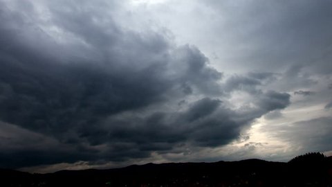 Background of storm clouds before a thunder-storm in the mountains landscape. Time lapse.
