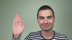 Young adult man smiling and waving his hand to the camera.
This video clip was shot in 4K Ultra High-Definition and offers four times the resolution of Full HD