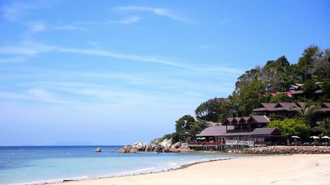 Tropical Paradisaical Beach with Bungalows on the Coastline from Resort. Amazing Blue Sky and Calm Turquoise Sea. The Coral Cove Beach on Koh Samui. Thailand. HD, 1920x1080.