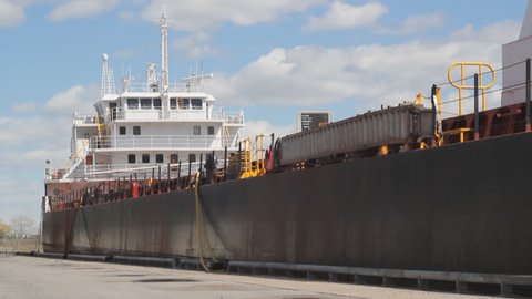 Timelapse shot of cargo ship at dock. Port of Montreal, Quebec, Canada.  