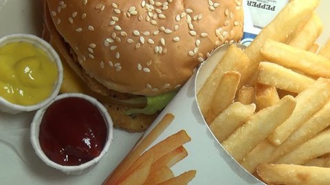 SYRACUSE, NEW YORK – June 27 2014: Hamburger and Fries from Burger King on June 27 2014 in SYRACUSE, New York