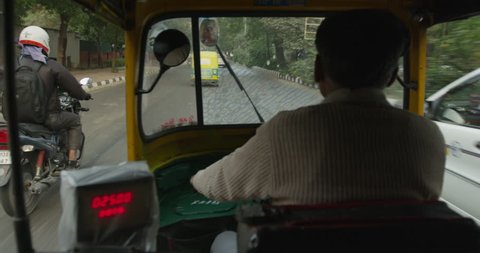 POV from inside an auto rickshaw.