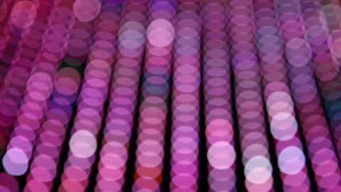Blurred neon lights, predominantly pink, moving across frame Vídeo Stock