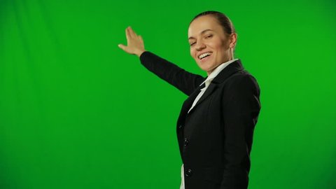 Weather girl is giving forecast on a green screen.FULL HD.