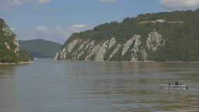 Kazan gorge entrance on river Danube from Romanian side 4K 2160p UHD footage -  Enjoying on boats in Cazanele Danube river gorge 4K 3840X2160 UHD video