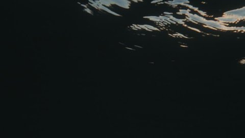 Sea surface shot from underwater at sunset in slow-motion. Shot on RED Cinema Camera in 4K, crop, rotate and zoom easily. H264 codec High bit rate.