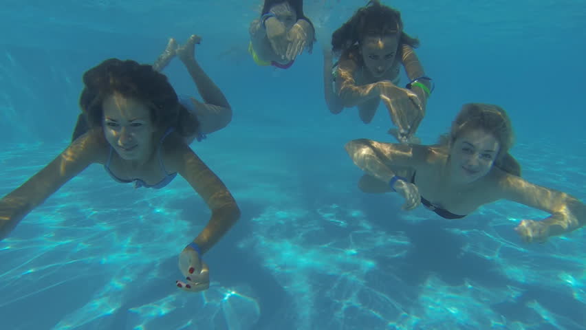 Beautiful girls in bikini swimming underwater | Shutterstock HD Video #7625038