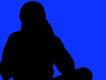 Photographer in silhouette against blue - NTSC