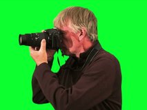 Photographer in silhouette green screen pan V2 - NTSC
