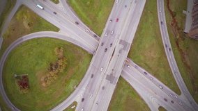 Descending Aerial Footage of Highway and Overpass Urban Life with cars and trucks
