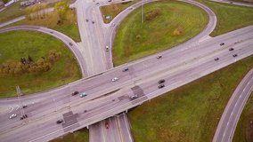 Ascending Aerial Footage of Highway and Overpass Urban Life with cars and trucks
