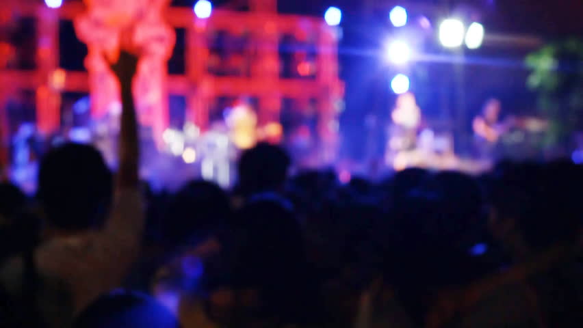 footage of some cheering fans at a rock concert, some visible noise due high ISO, soft focus, also normal speed version Royalty-Free Stock Footage #7651711