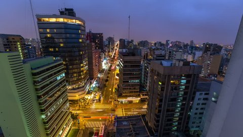Panning time lapse of Lima cityscape at dusk into night. Stock Video