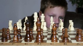 Video clip shows the little boy fascinated by the game of chess

