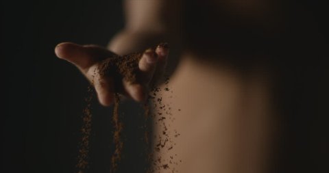 Cu of Kid's hand dropping Soil in super slow motion