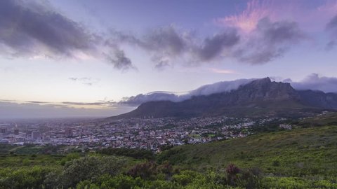 4K Timelapse 4096x2304 UHD of Cape Town Table Mountain at sunset, from day to night as the sun sets over the ocean. Holy grail timelapse shot in Cape Town South Africa