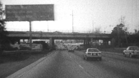 Vintage 1986 super 8 time lapse driving shot of the Hollywood 101 Freeway in Los Angeles, California. 