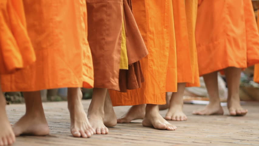 monks  doing there  alms rounds in lao