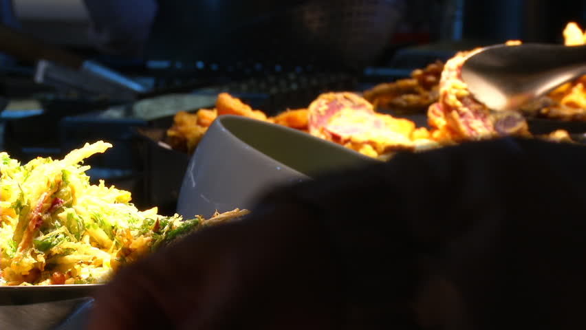 Restaurant guests selected food from a buffet