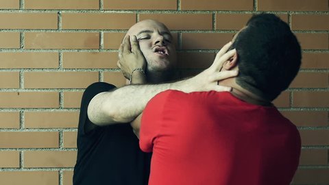 two men fights putting their hands over faces and neck Slowmotion