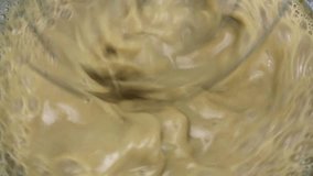 Video of a very fast mixing of butterscotch pudding in milk.