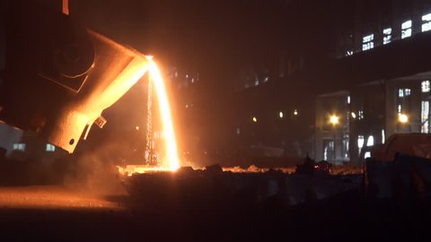 Iron and Steel Works. Pouring of molten iron.